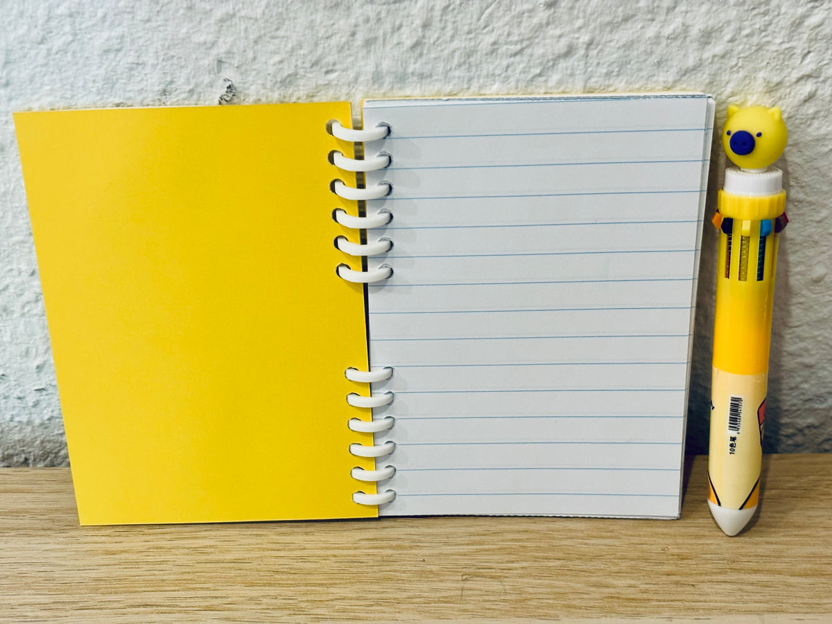 Notizheft + Buntstift