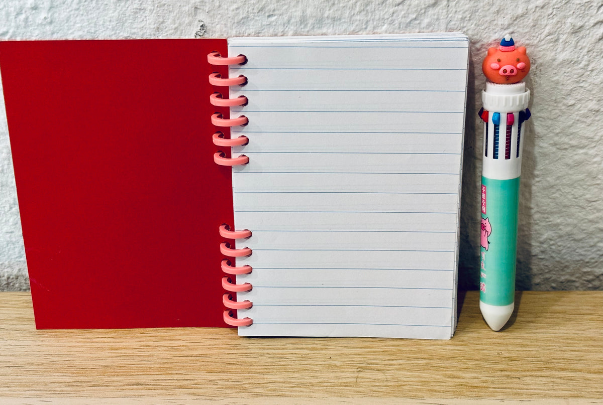 Notizheft + Buntstift