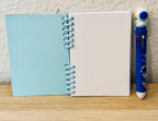Notizheft + Buntstift