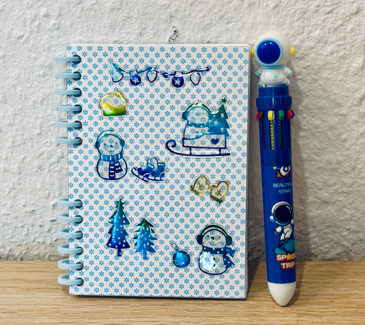 Notizheft + Buntstift
