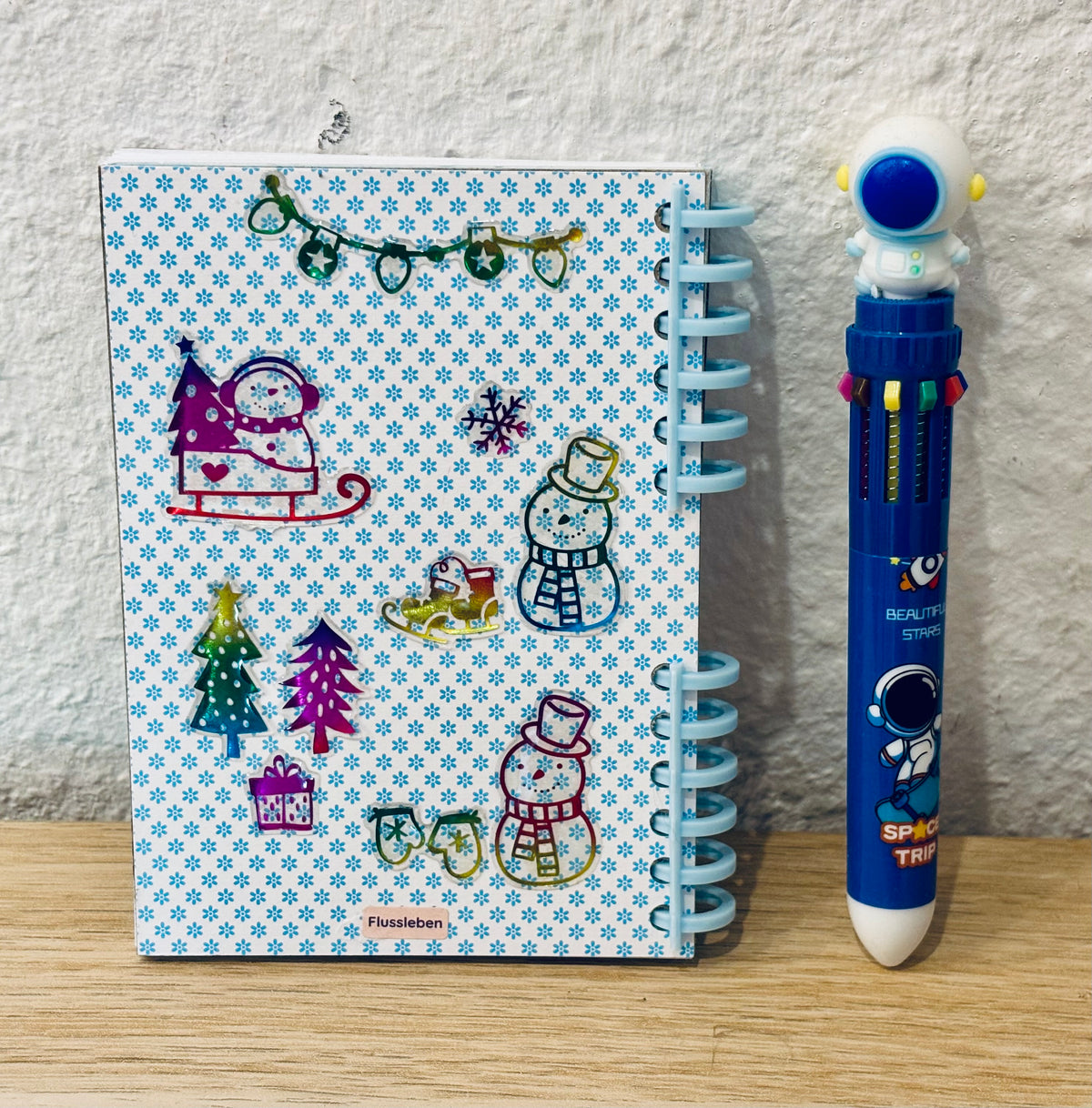 Notizheft + Buntstift